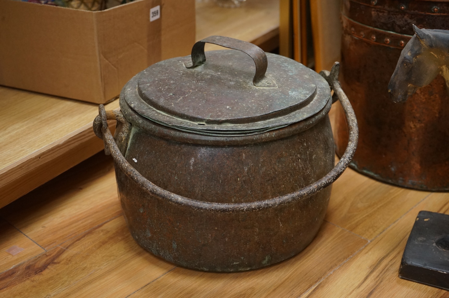 Two copper vessels and a plaster model of a horse